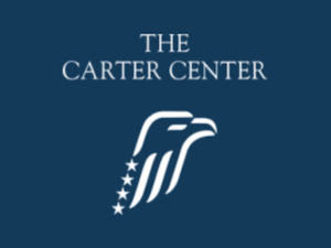 The Carter Center's logo shows the profile of an eagle styled in stars and stripes