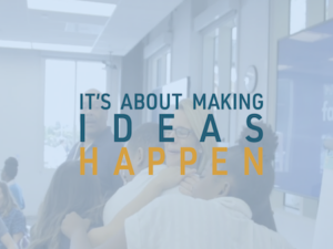 People embrace and text reads "It's about making ideas happen"