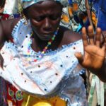 A woman in colorful clothing dances