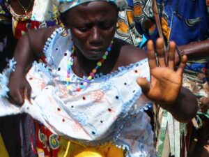 A woman in colorful clothing dances