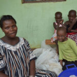 A woman and children sit together