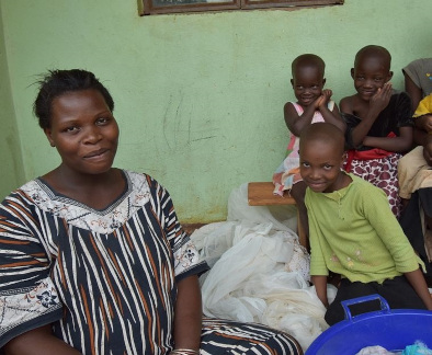 A woman and children sit together